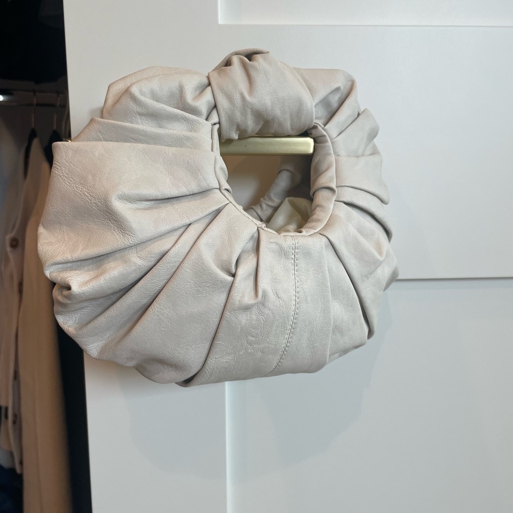 Cream croissant bag clutch